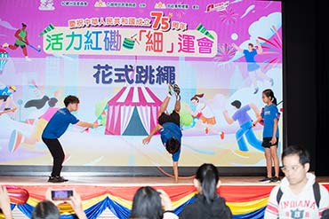 Residents enjoy sport-themed stage performances. 2